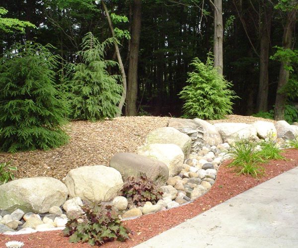 landscaping with boulders and trees